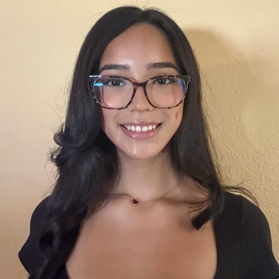 Portrait of Paris Sanchez, a professional stylist at K Style Salon & Bodyworks, showcasing their expertise and style.