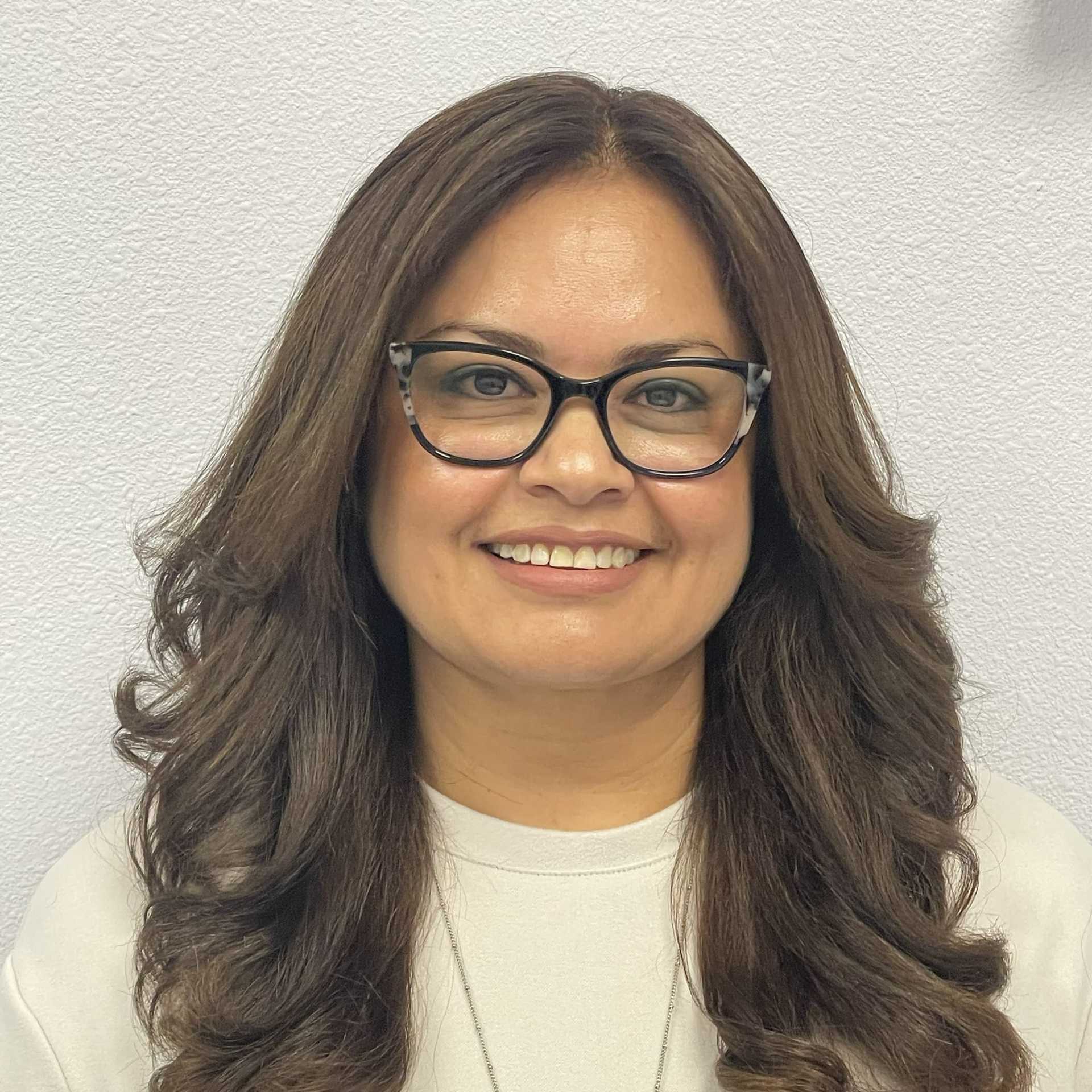 Portrait of Veronica Perez, a professional stylist at K Style Salon & Bodyworks, showcasing their expertise and style.