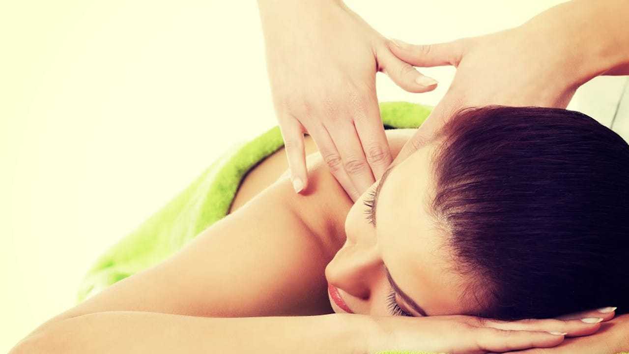 Person receiving a relaxing shoulder massage.